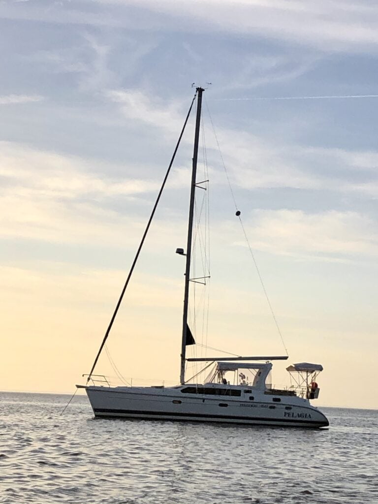 Photo of our current boat Pelagia, 45 foot Hunter, anchored at Dauphin Island, Alabama. The photo was taken during sunset.