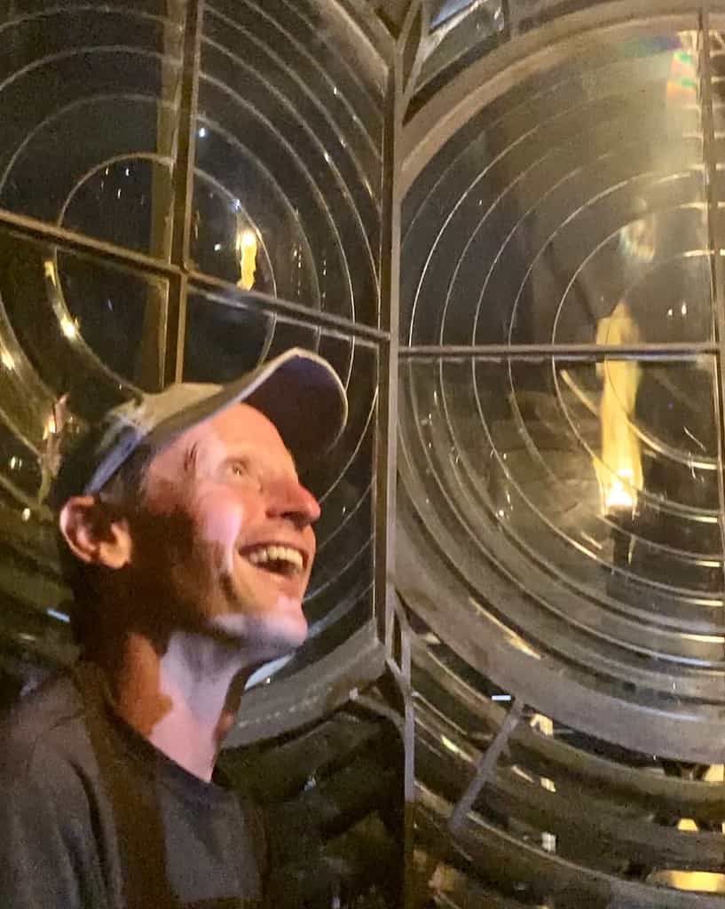 Scott inside the lens of the lighthouse