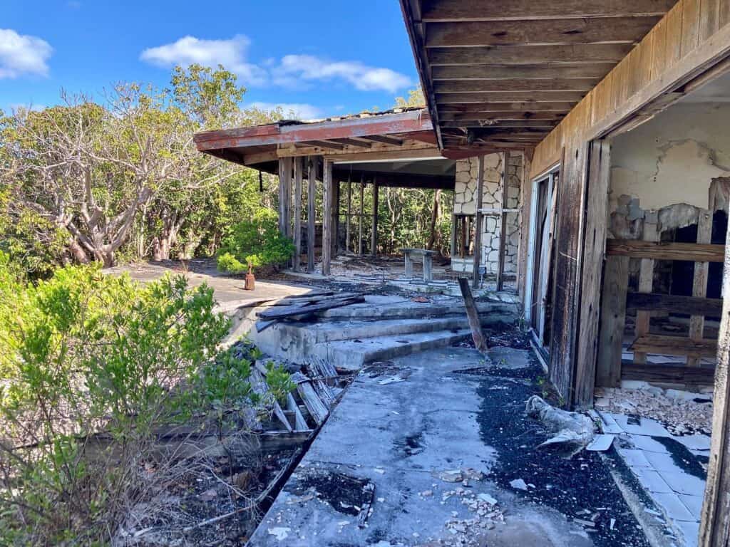 Abandoned drug lord home on Cistern Cay. It's really just a frame of a house now and overgrown with scrub shrub.