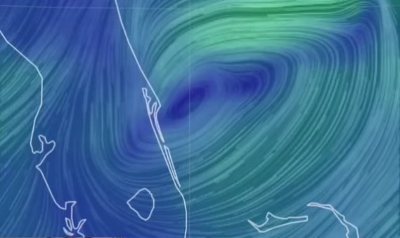 Low pressure system shown off the east coast of central Florida shown in a large flat oval with the center just off the coast of Port Canaveral. 