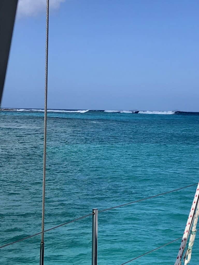 Waves breaking on shallow waters just outside of the channel at Emerald Bay Marina.
