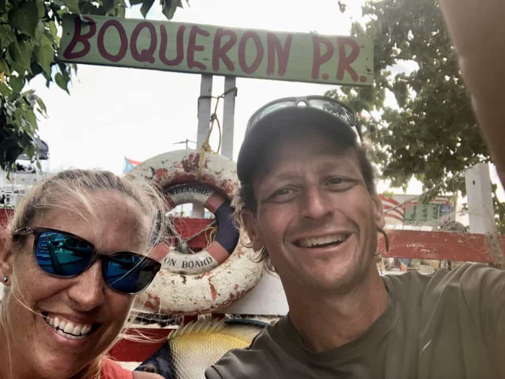Scott and me posing for a selfie in front of a Boqueron, PR sign.