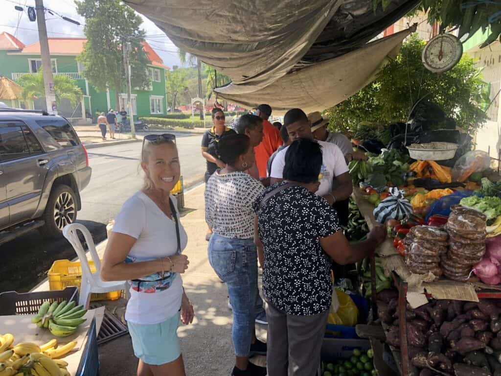 Sailing in the Dominican Republic brings me to the produce market buying purple potatoes on the streets of Samana