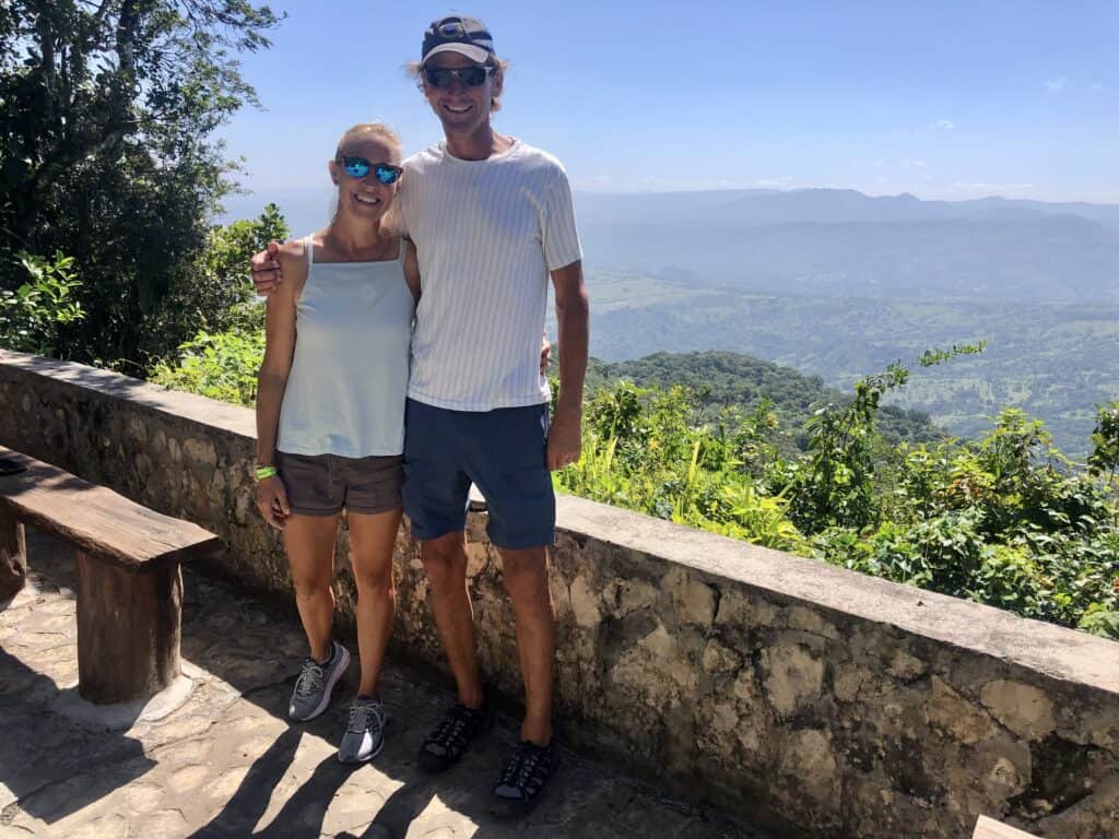 Scott and me on top of Isabel de Torres Mountain with mountain views in the background on a sunny day.