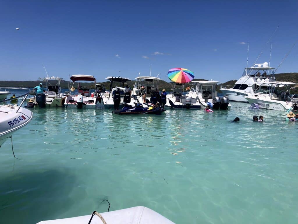 Boaters rafted up in blue water near the mangroves in La Parguera