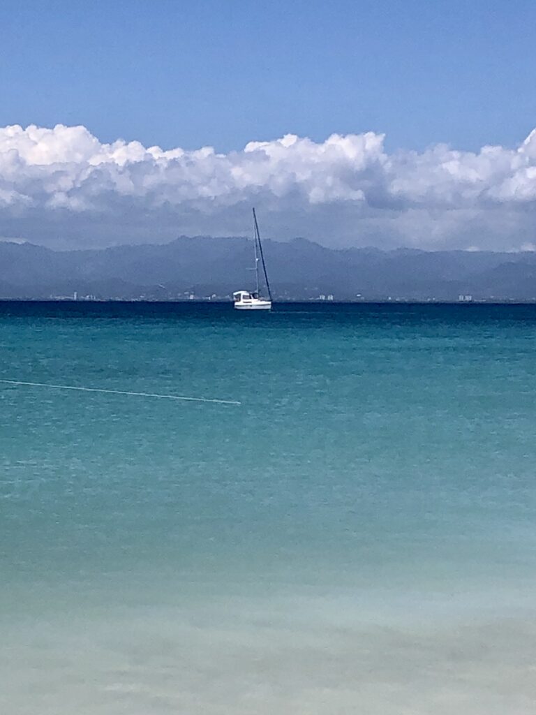Pelagia anchored in the clear waters off of Caja de Muerto on a sunny day