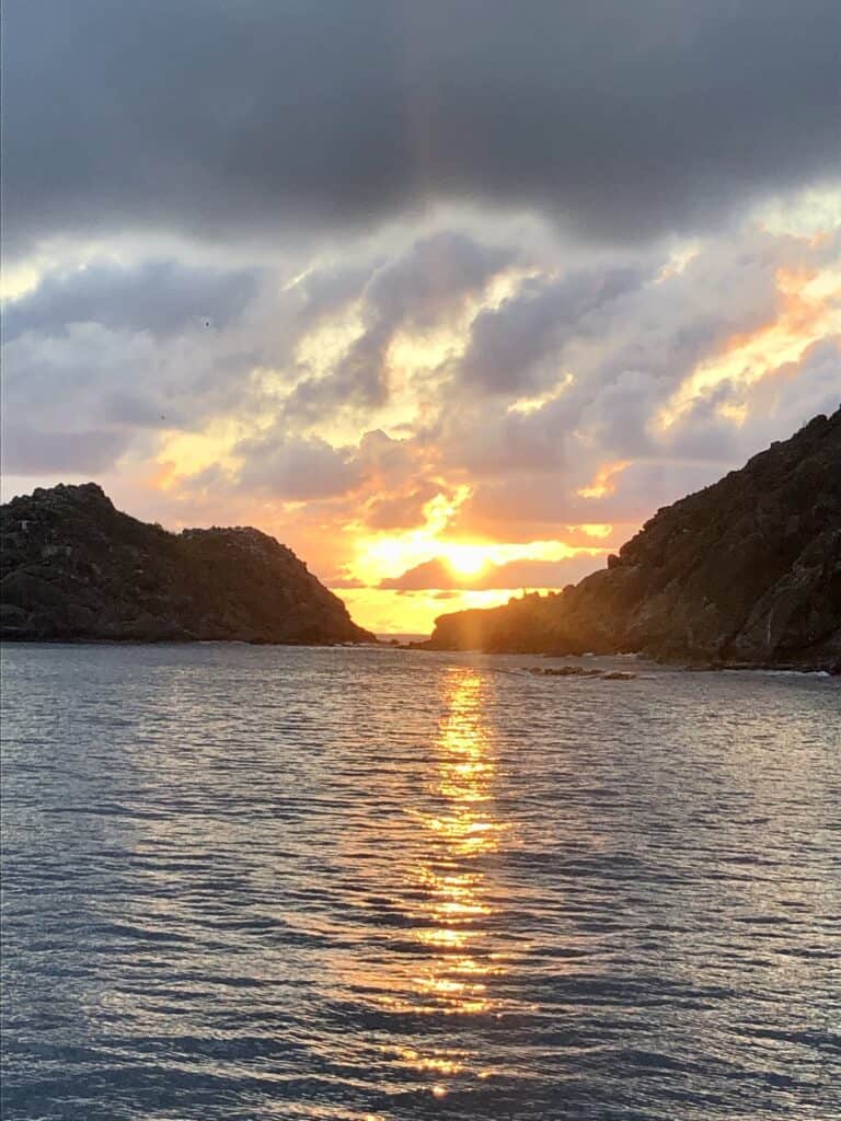 Sunset between the mountains at the Ile Fourchue Anchorage
