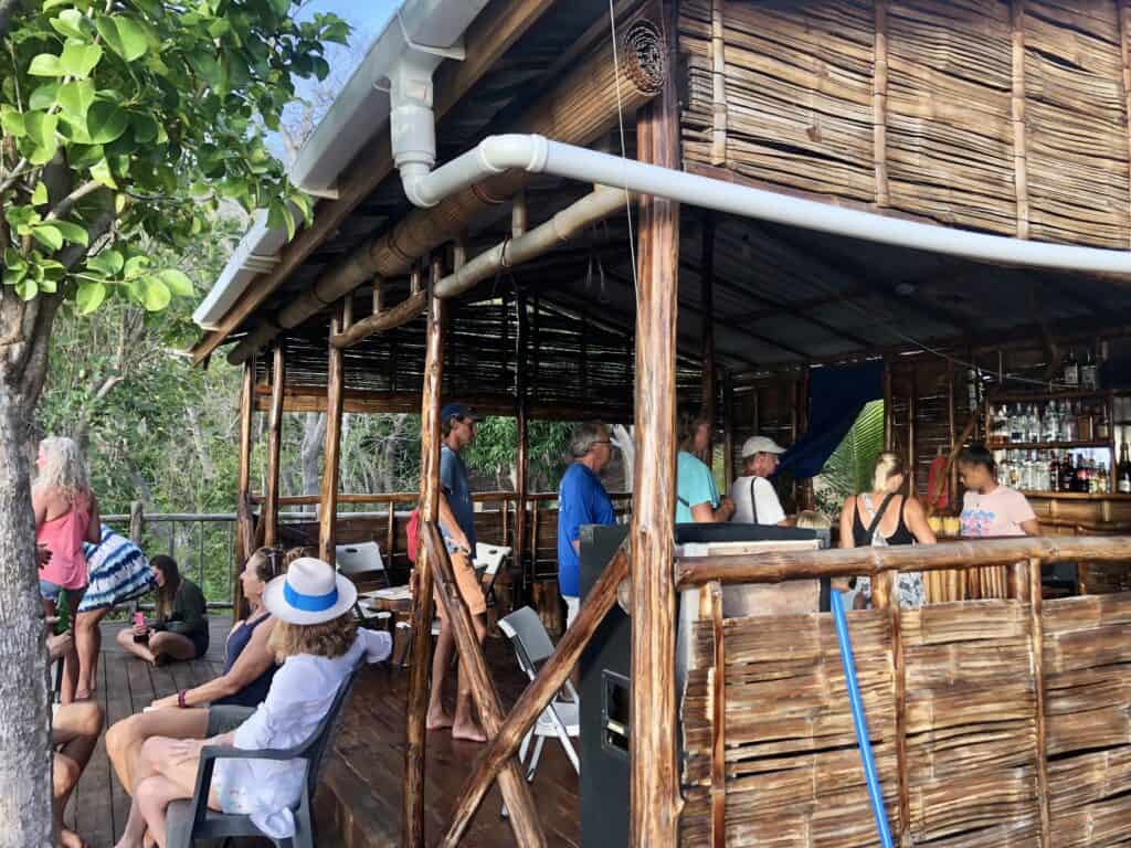 Cruisers enjoying Happy Hour on the deck and inside the Treehouse Bush Bar.